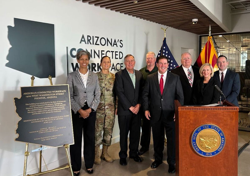 Governor Ducey celebrates the dedication of Arizona's Connected Workspace with directors of state agencies. From left to right: Col. Wanda Wright, Maj. Gen. Kerry Muehlenbeck, Tom Buschatzke, Allen Clark, the governor, Andy Tobin, Jami Snyder and Louis Dettorre.
